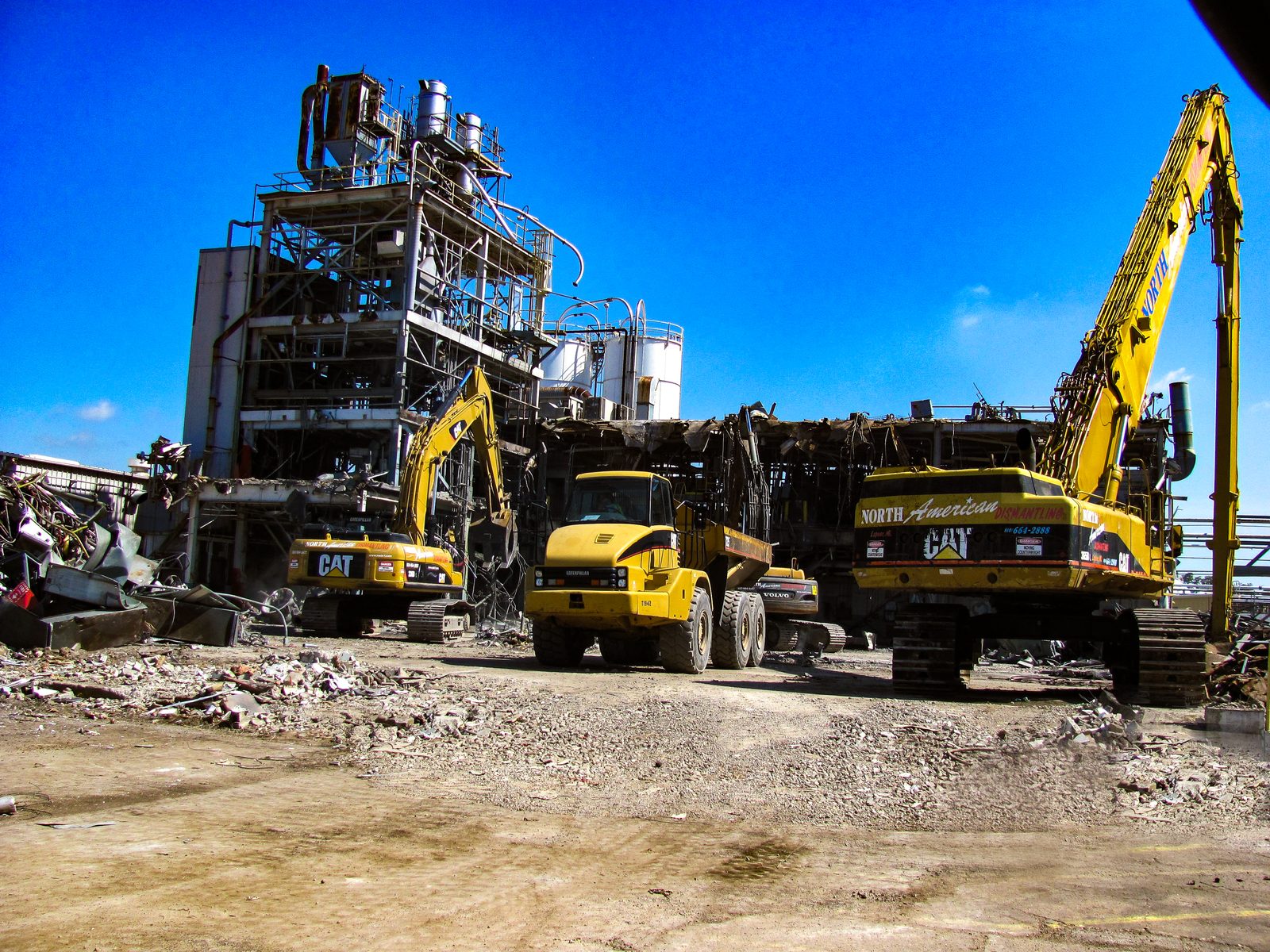 Excavators processing debris during demolition of the SABIC plastics plant